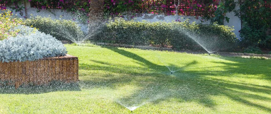 Sprinkler system spraying water on lawn in New Smyrna Beach, FL.