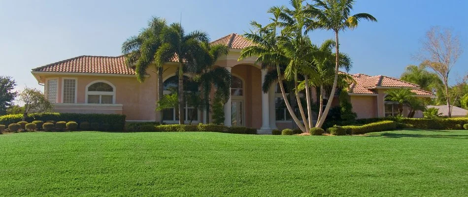 House in Flagler Beach, FL, with green lawn.