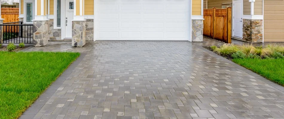 A property in New Smyrna Beach, FL, with a wet driveway.